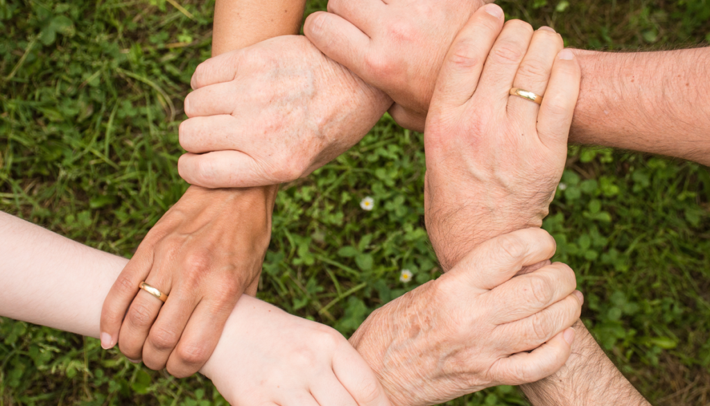 Picture of several hands holding each other