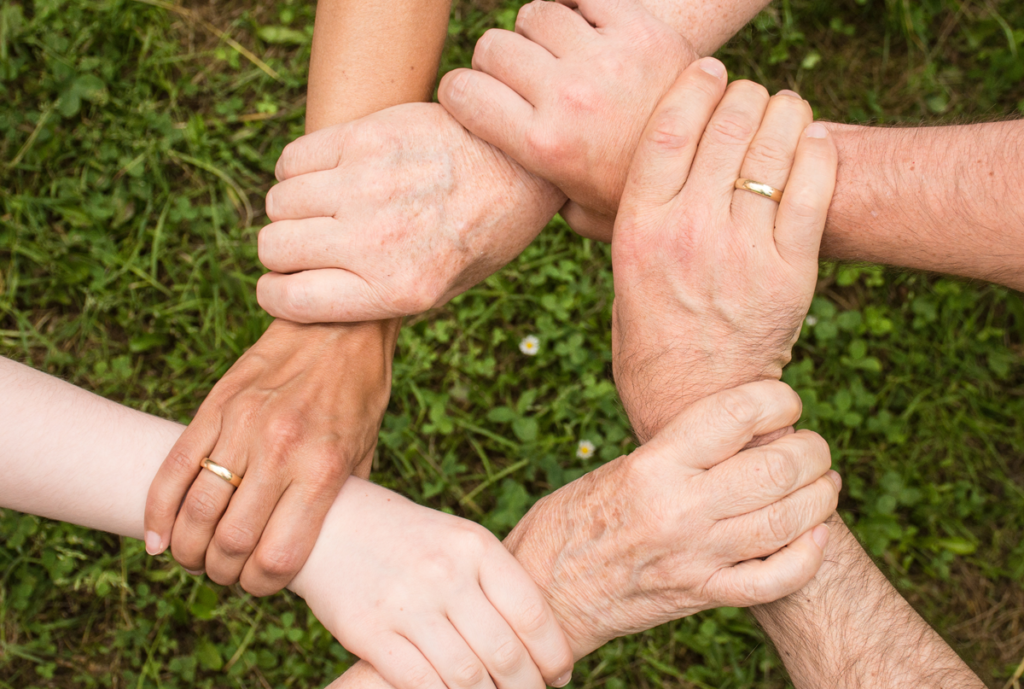 Picture of several hands holding each other