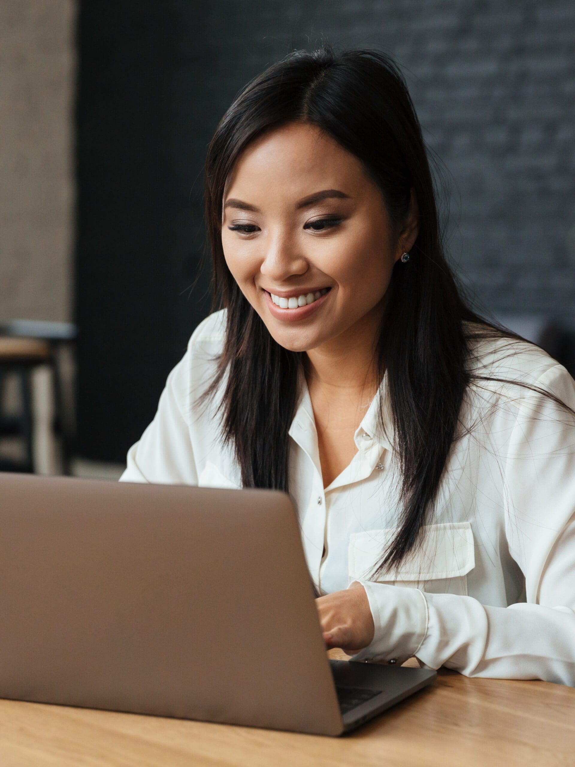 A woman searching on her laptop, "Abortion Pill Education and More in Williamsport and Lewisburg, PA"