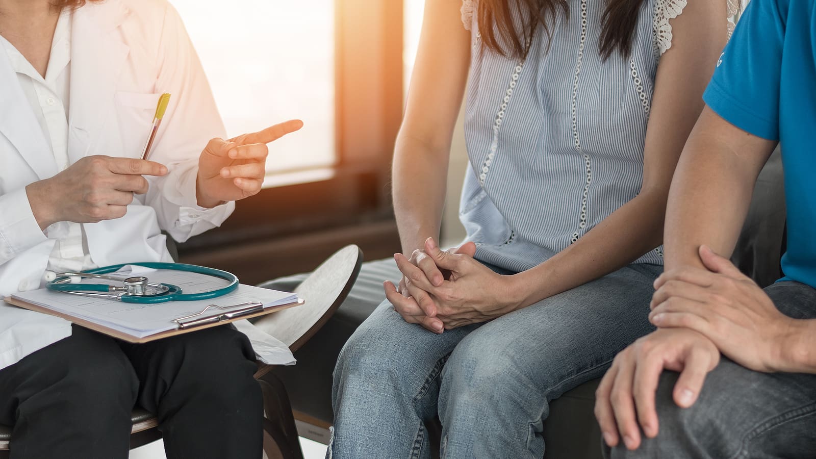 A couple discussing values and lifestyle with professional staff