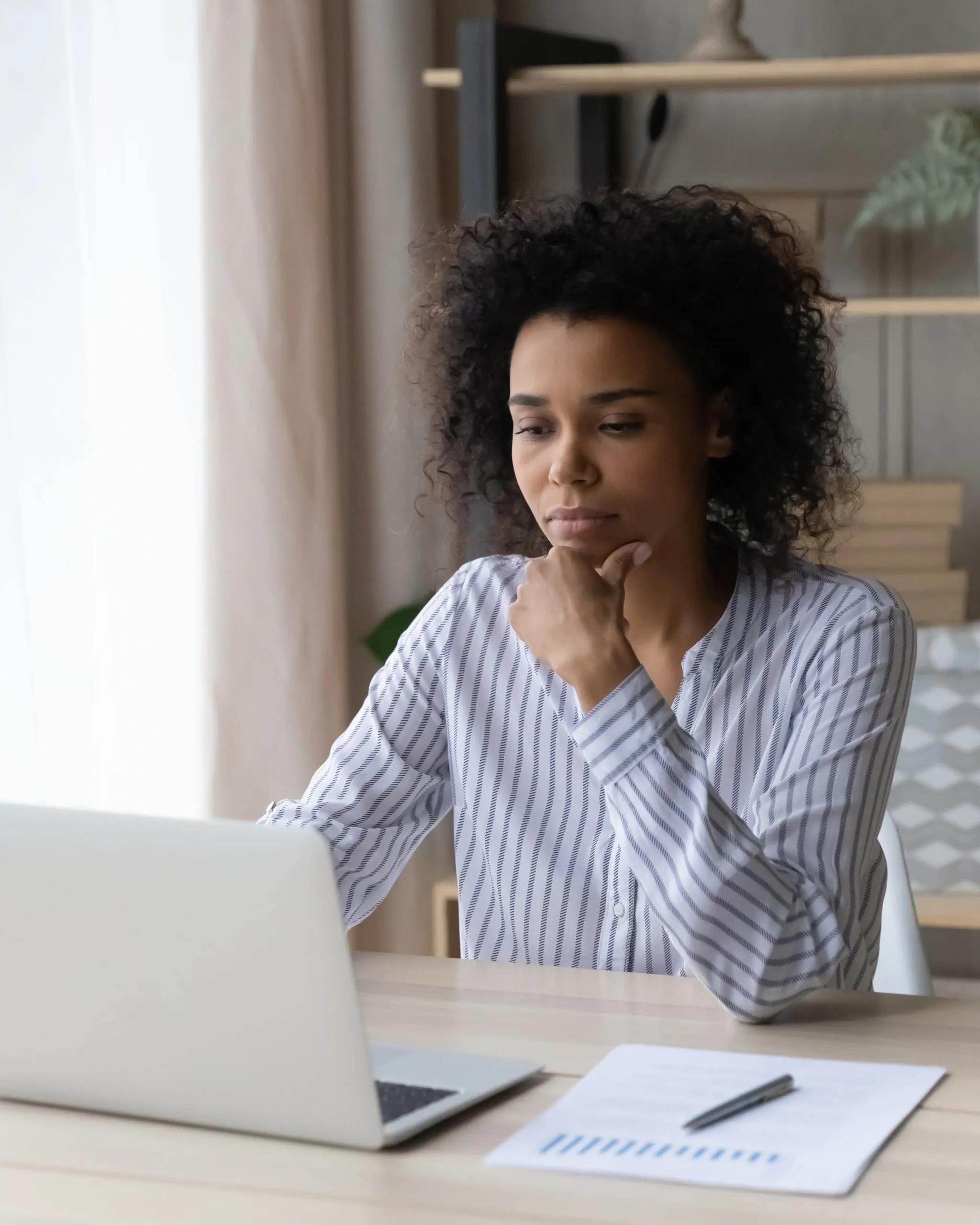 A woman searching on her computer, "How Does Abortion Pill Reversal Work?"