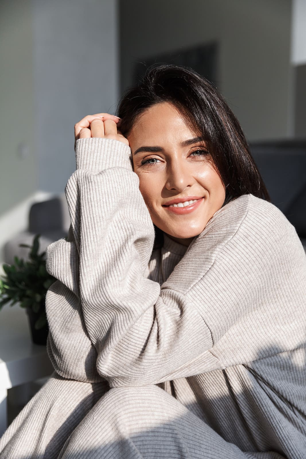 A woman smiling after her appointment at Expectations Women's Center