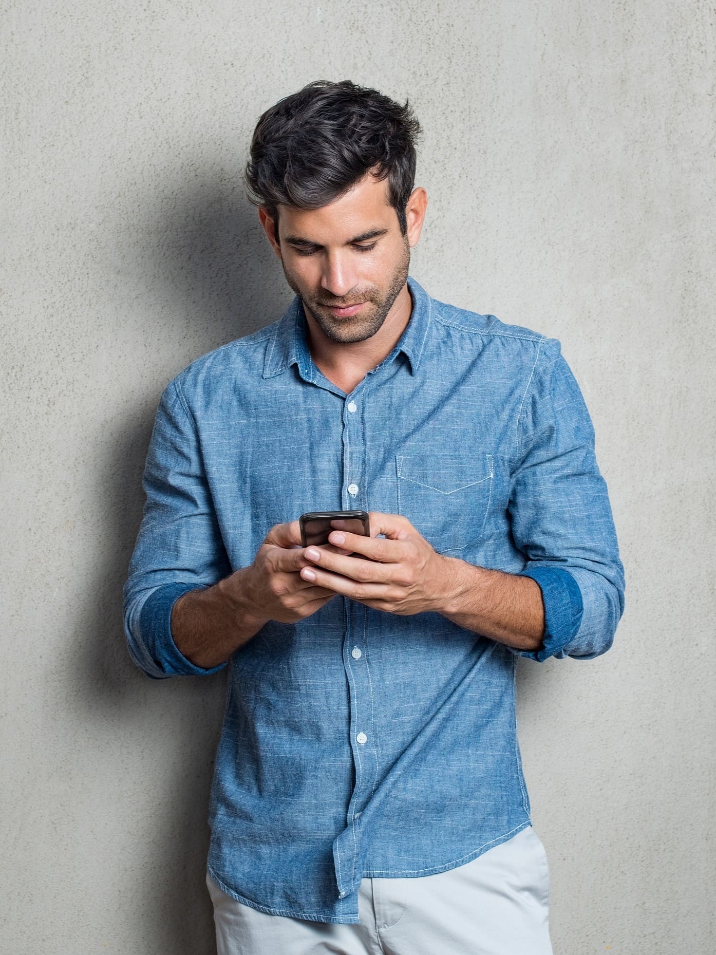 A man searching on his phone, "Resources for men at Expectations Women's Center""